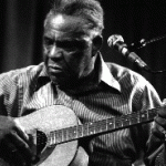 Photograph of Snuff Johnson playing the guitar